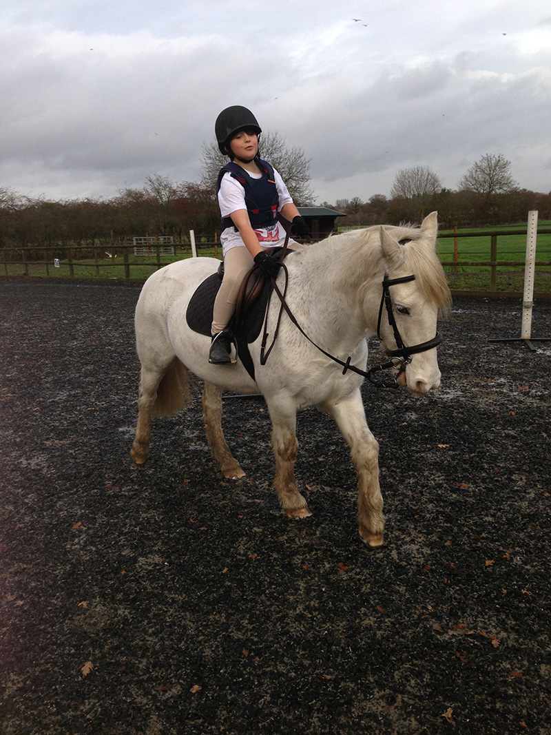Child enjoying a pony day at Littlefield Manor